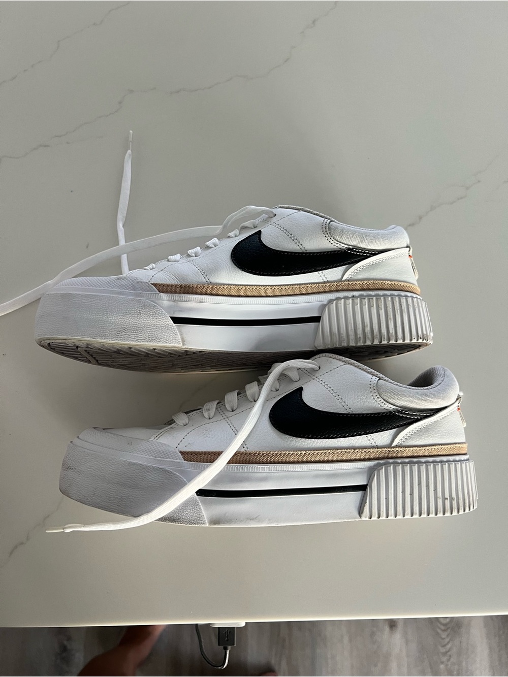 Nike White Low-Top Sneakers with Black Swoosh and Tan Stripe
